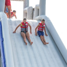 Two children sliding on the Aquaglide El Jefe