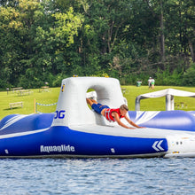Inflatable water toy on a lake with trees in the background
