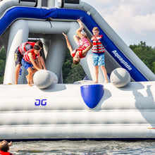 Children playing on an inflatable water slide with 'Aqua glide' branding.