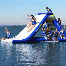Inflatable water slide with people on a lake