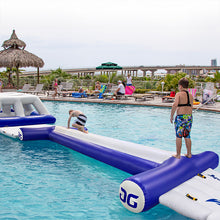 Inflatable water park with people around a pool