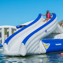 Inflatable water slide with children on a clear day