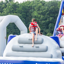 Person on an inflatable structure with a life jacket in an outdoor setting