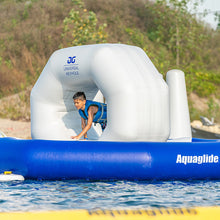 Child playing on an inflatable water slide with 'Aquaglide' branding 
