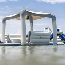 Aquaglide Ohana Lounge on a body of water with clear sky.