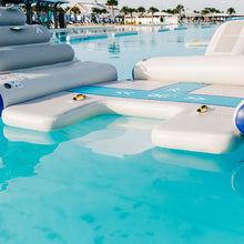 Inflatable pool toys on a clear blue pool