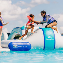 Children on an inflatable water toy with 'AG Aquaglide' branding in a pool.