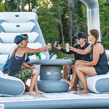 Three people sitting on Aquaglide Ohana Lounge 