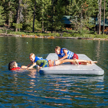 Children playing on Full Deck 15.0  in a lake surrounded by trees