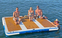 Four people on Island Hopper Mega Yacht Dock in the water