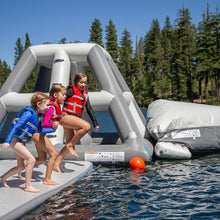 Three children wearing life jackets play on Aquaglide Full Deck 15.0
