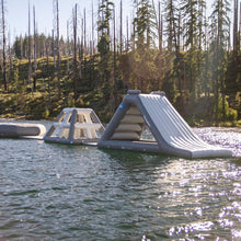 Aquaglide Spire 6.8 with a forest shoreline in the background.