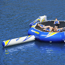 Inflatable water platform with people on a body of water