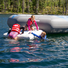 Three children play on Aquaglide Recoil Tramp 14.0 w/ C-Deck 