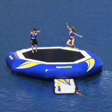 Two people Aquaglide Water Trampoline Supertramp 23 in the middle of a body of water