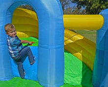 Child playing on Island Hopper Curved Double Slide 