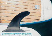 Close-up of a surfboard fin with text 