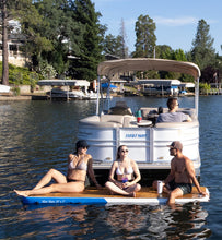 People enjoying a day out on a lake with Island Hopper Mini Mate Inflatable Boat Dock 10 x 3 ft Slim Dock Platform