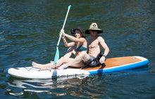 Two people on a paddleboard in the water